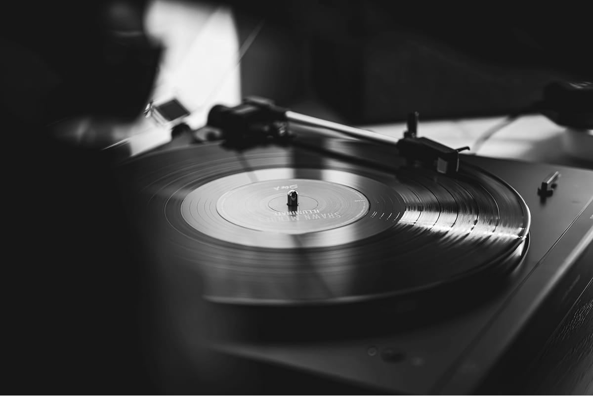 Turntable with a vinyl record on a dark background